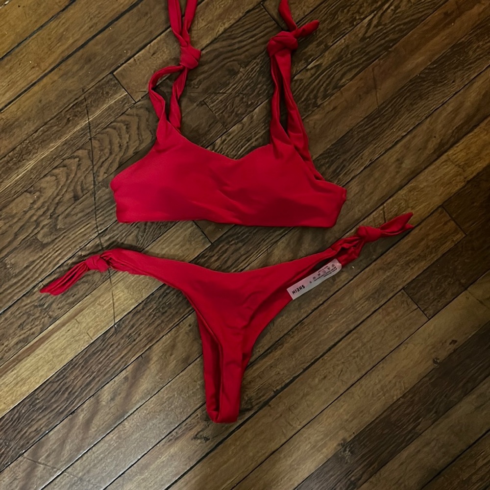 Red bathing suit with ties at shoulders and ties at waist